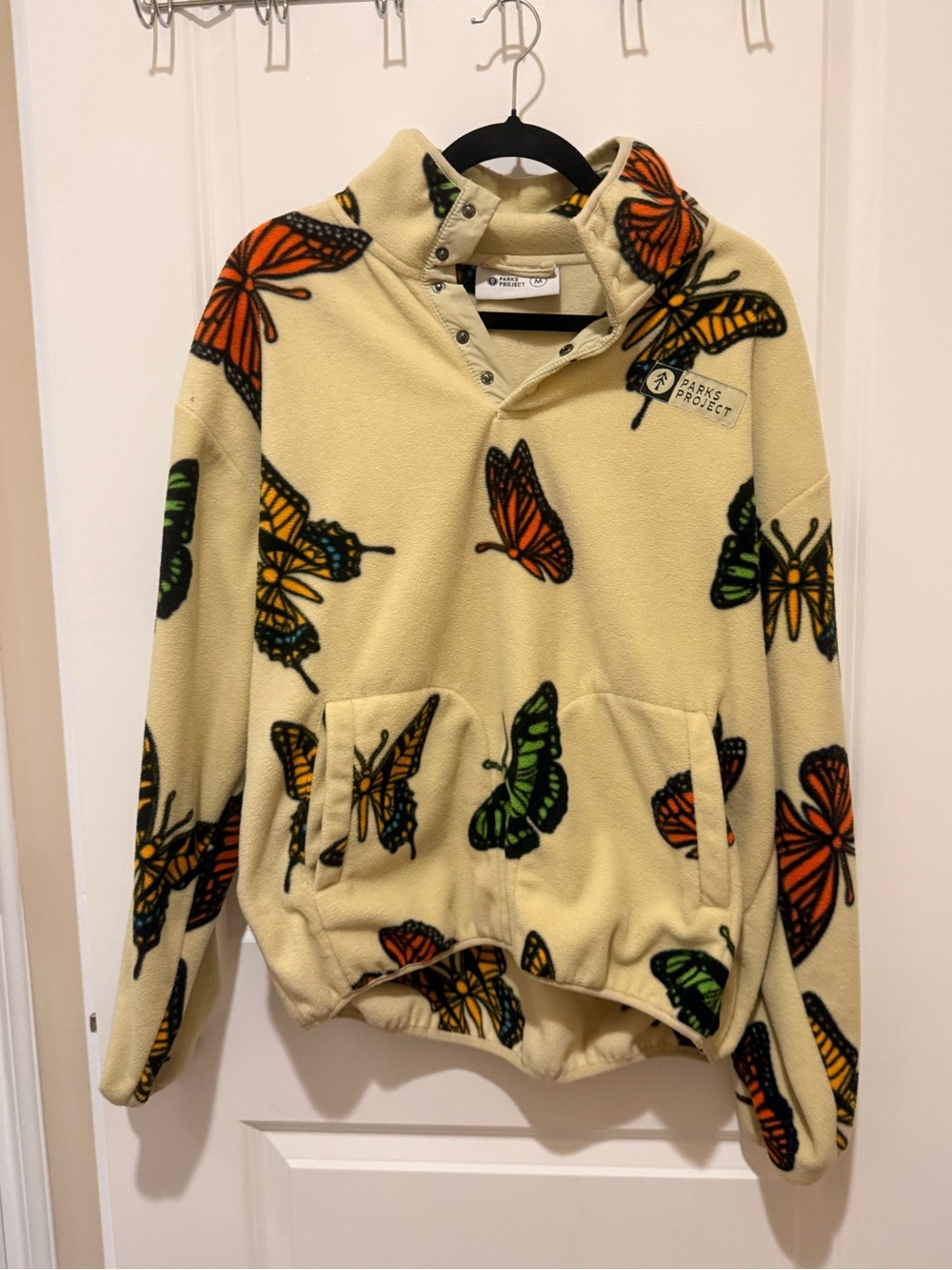 Parks Project Cream Fleece Pullover with Orange & Green Butterfly Print